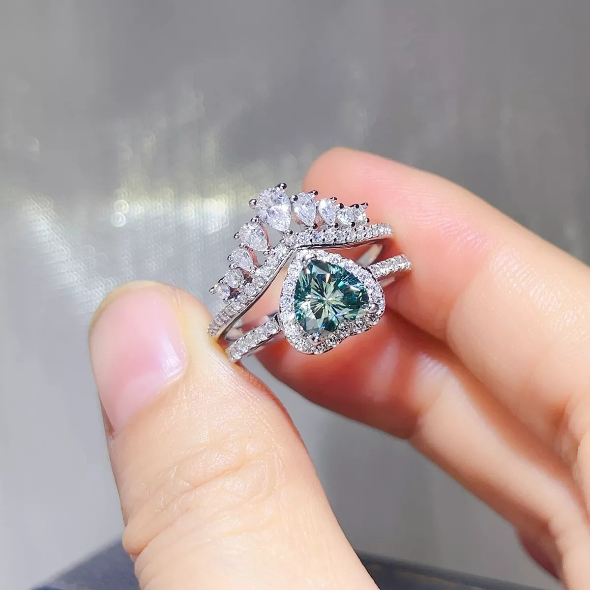 Heart cut turquoise stone in a crown setting shown from the side