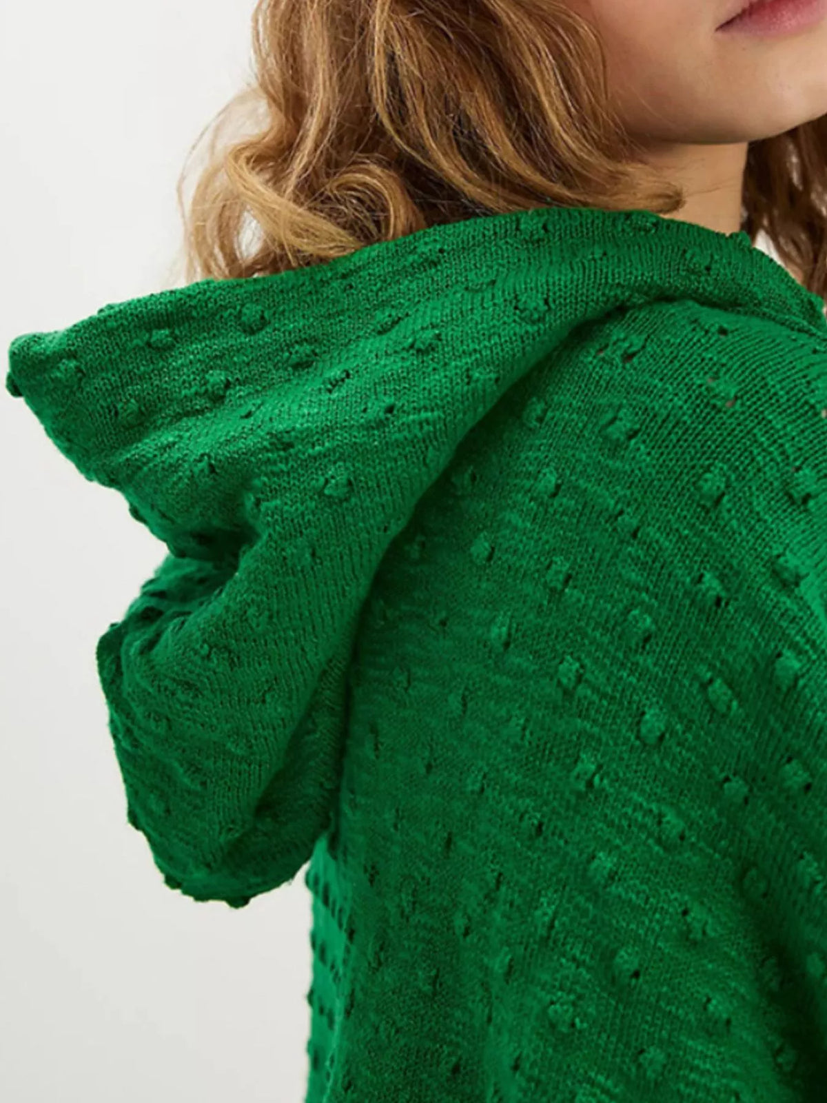 Textured dot knit hooded sweater texture close up