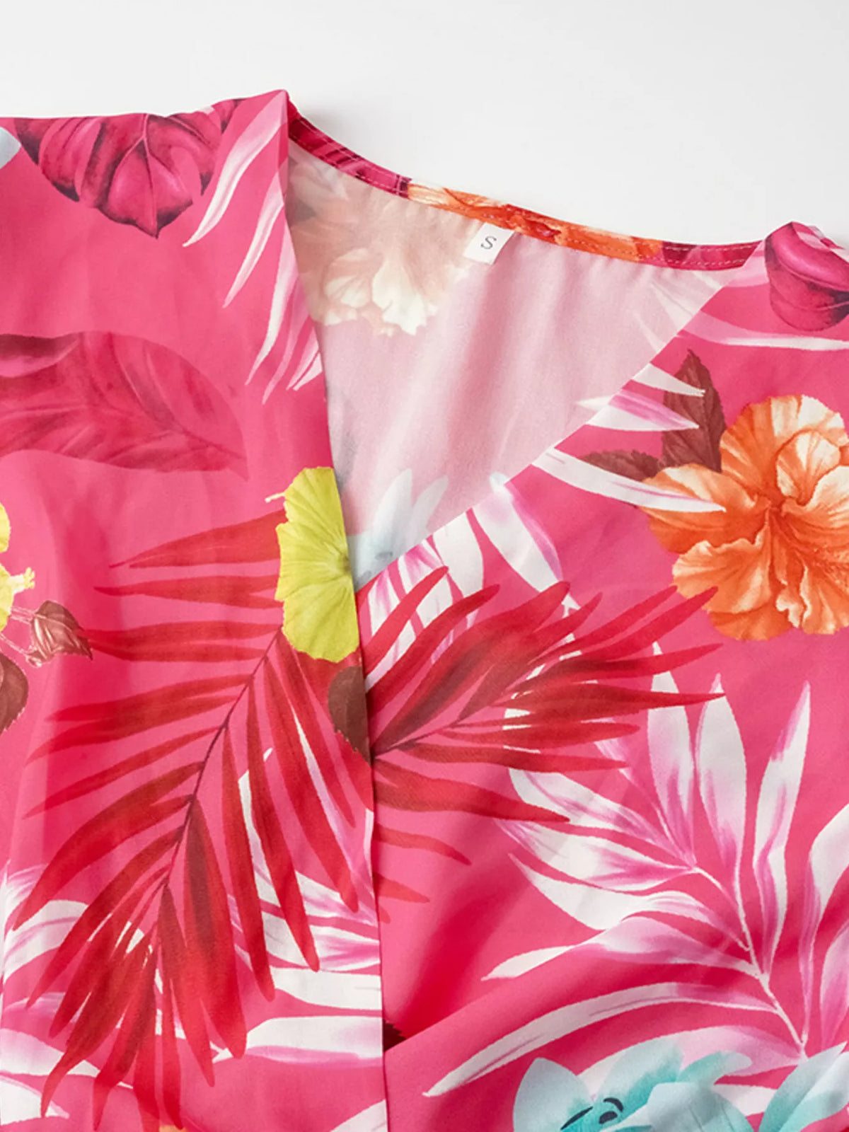 Back view of the belted tropical print dress