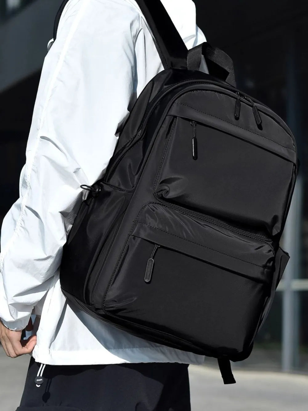 Gray backpack adjustable strap detail