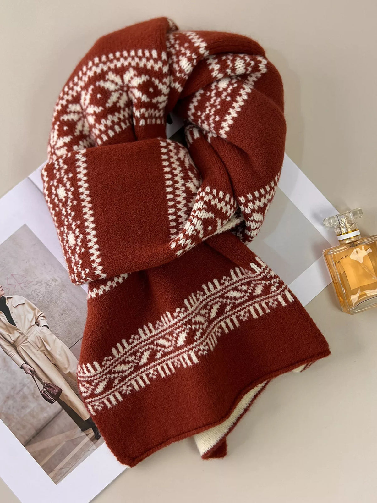 Snowflake knit scarf shown folded