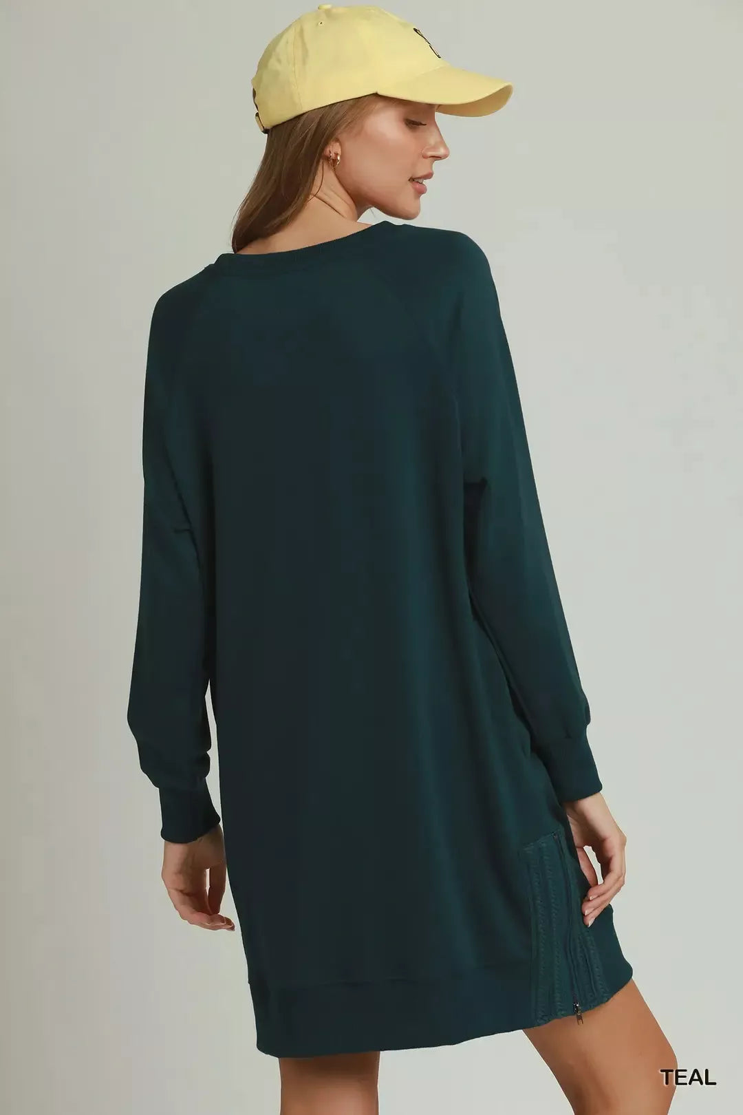 Side zipper hardware detail on the teal crochet dress