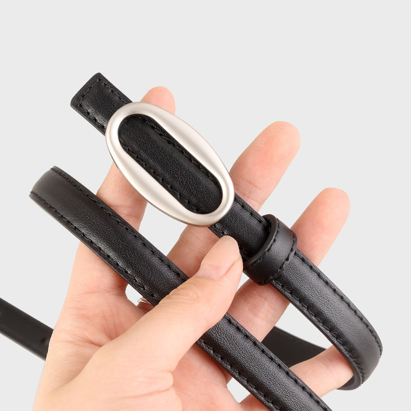 Oval buckle skinny leather belt coiled