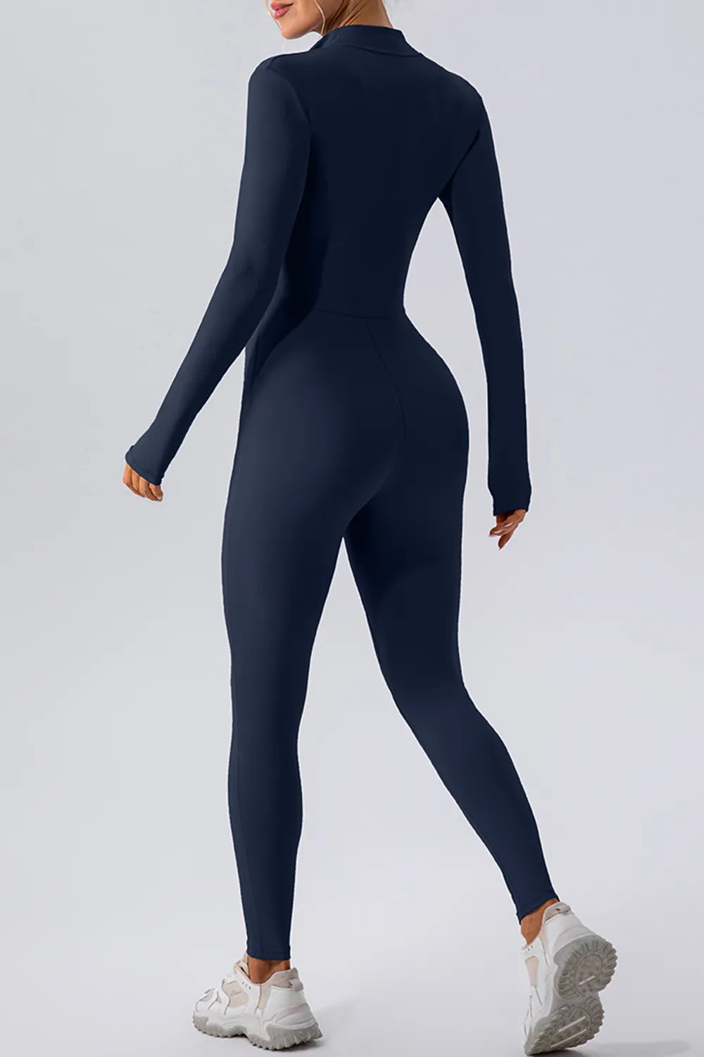 Half zip mock neck active jumpsuit close up fabric detail