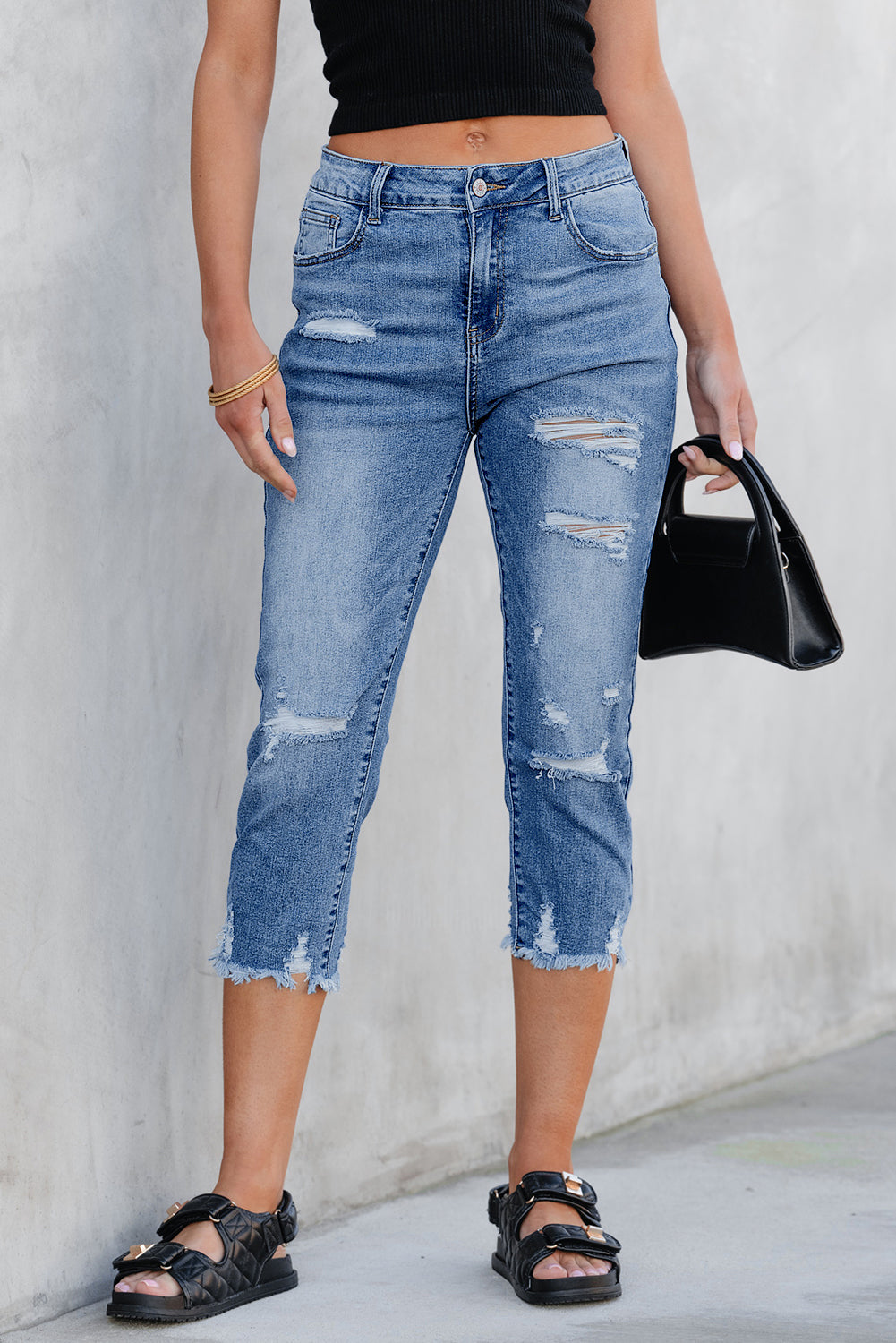 Sky blue distressed skinny capri jeans front view