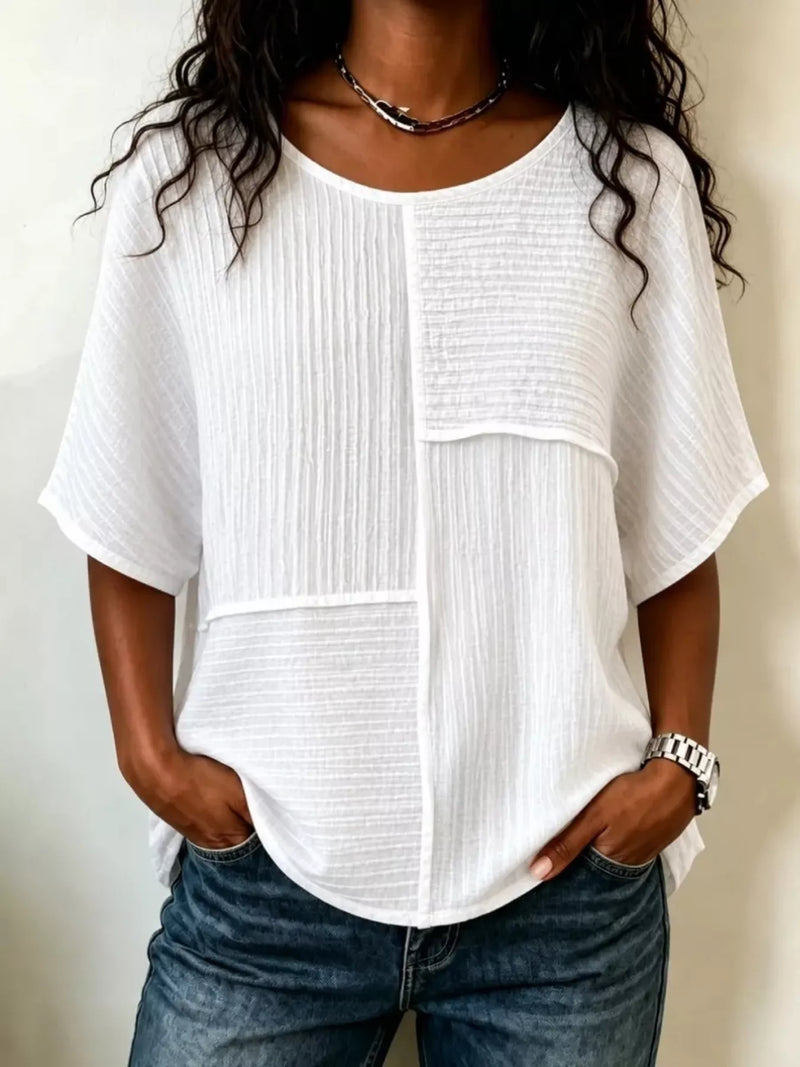 Textured round neck half sleeve blouse in white front view