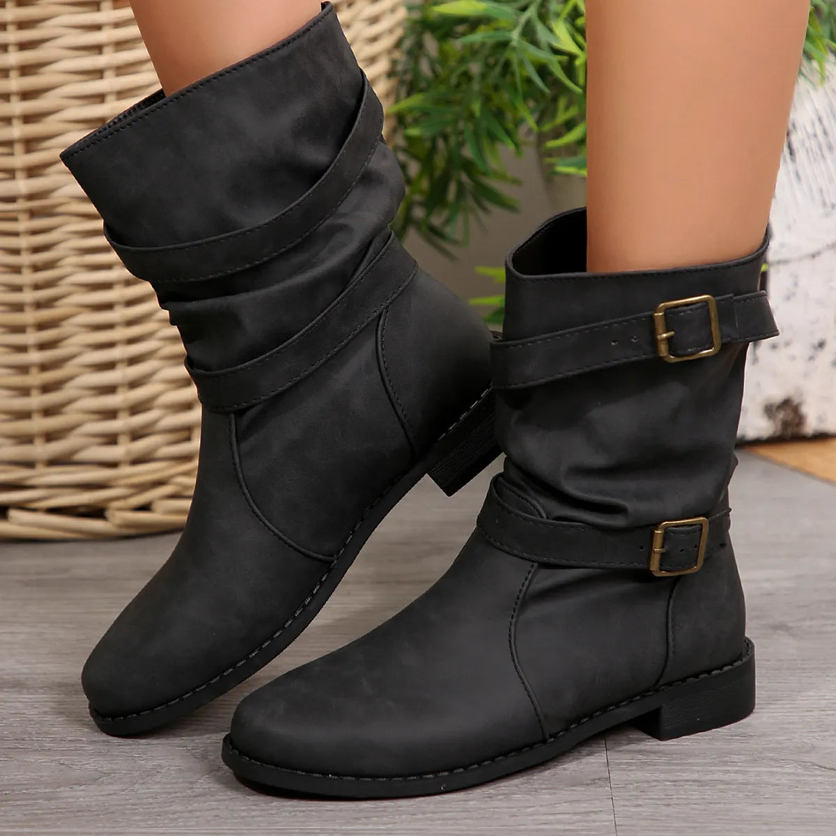 Mid calf buckle strap boots back of the shaft