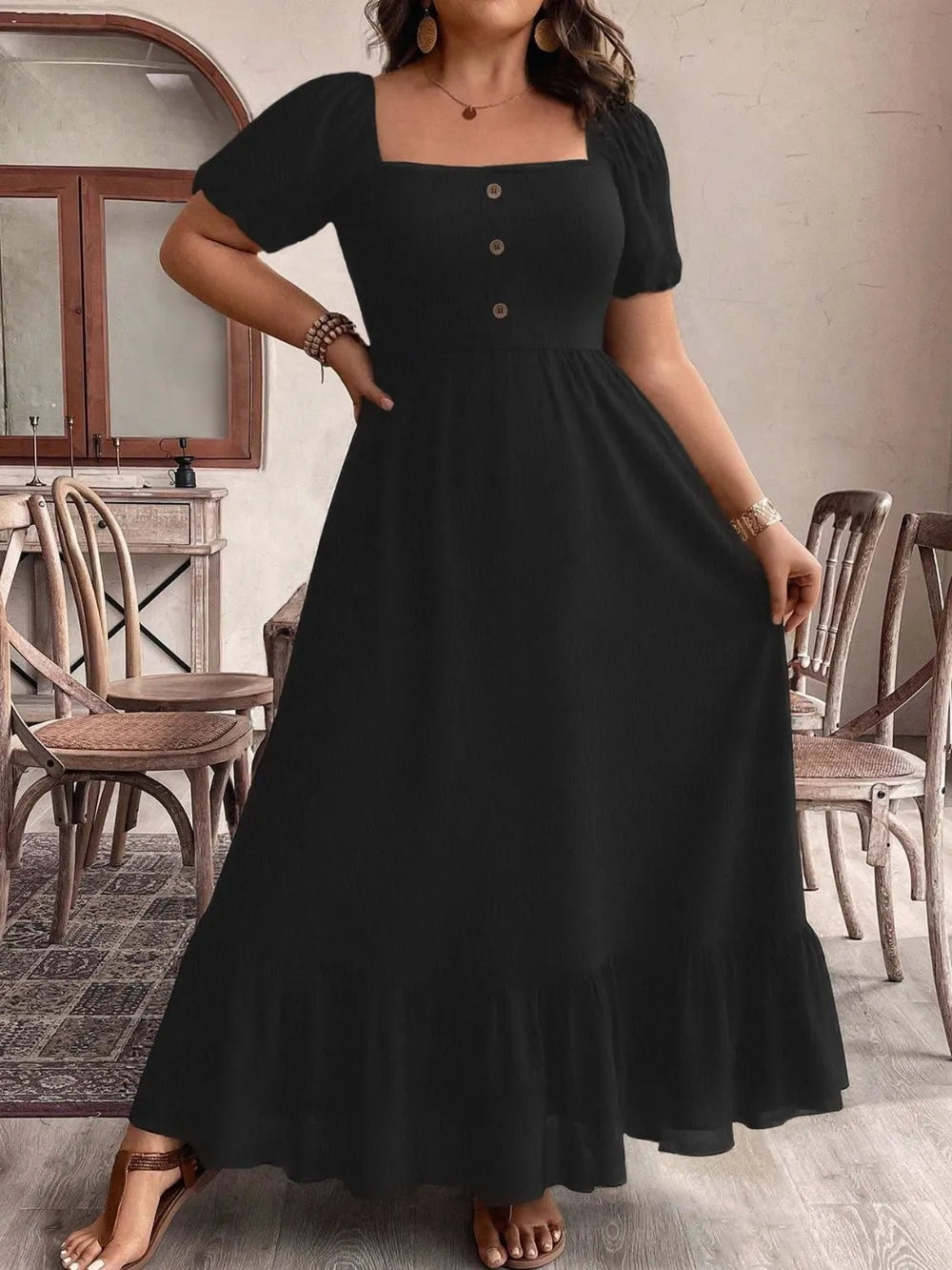 Black plus size square neck short sleeve ruffle hem maxi dress detail of the fabric and print