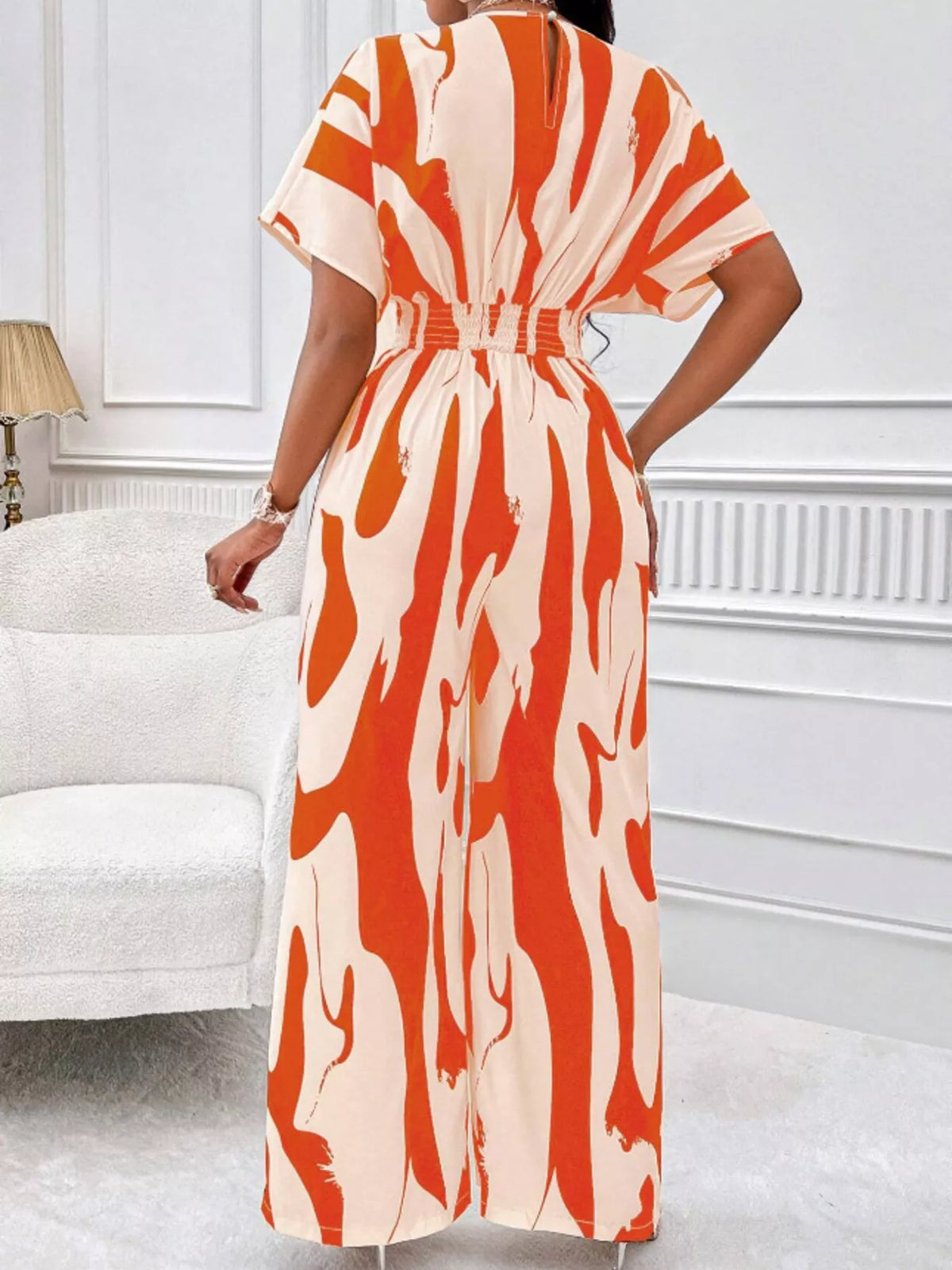 Abstract print wide leg jumpsuit with ruched bodice detail view