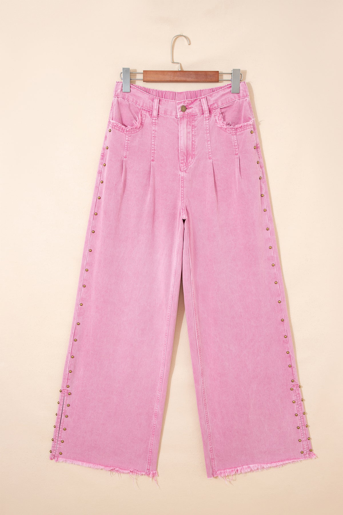 Side split hem detail on pink wide leg jeans