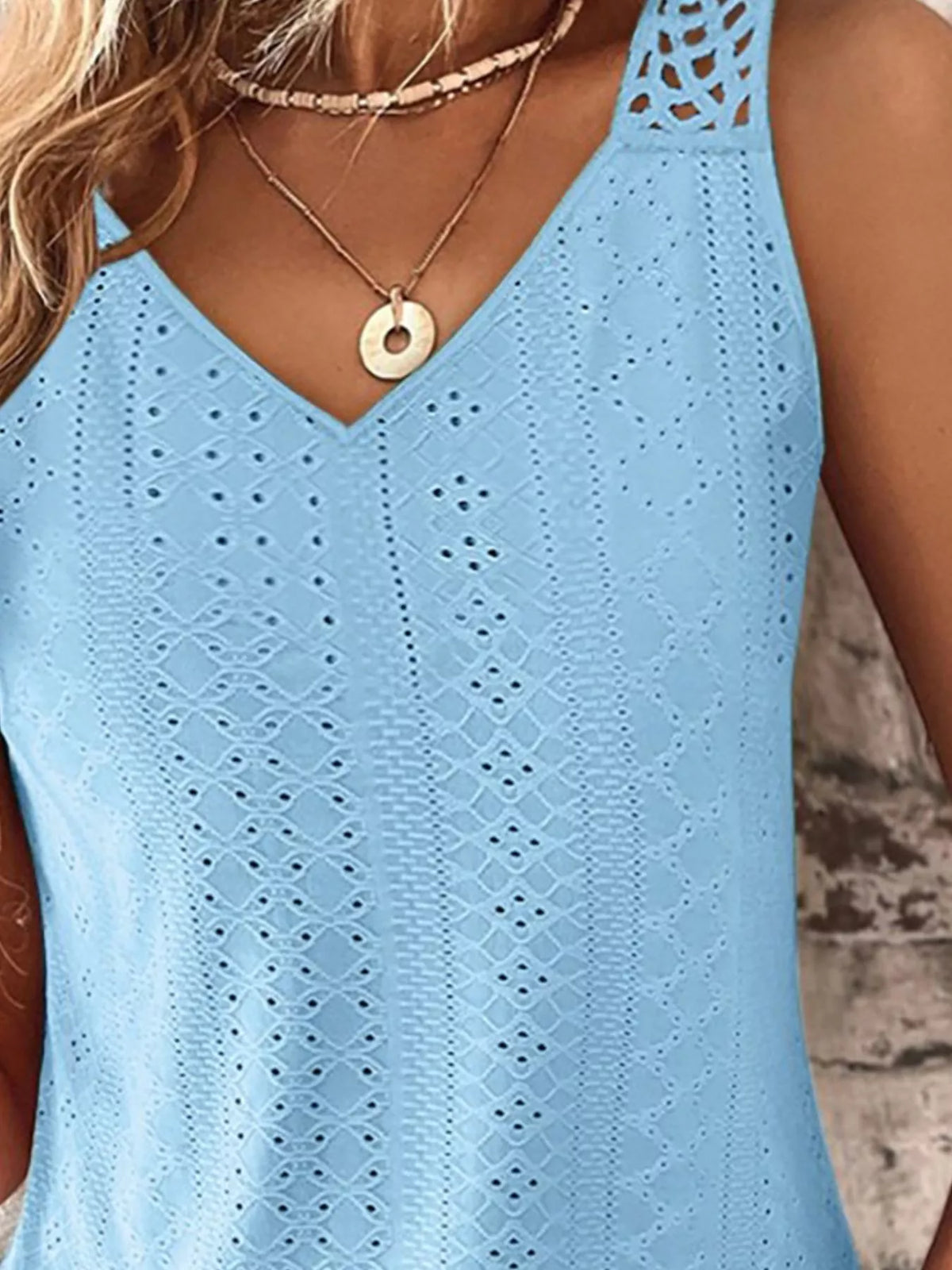 Close up of the shoulder strap and eyelet edging