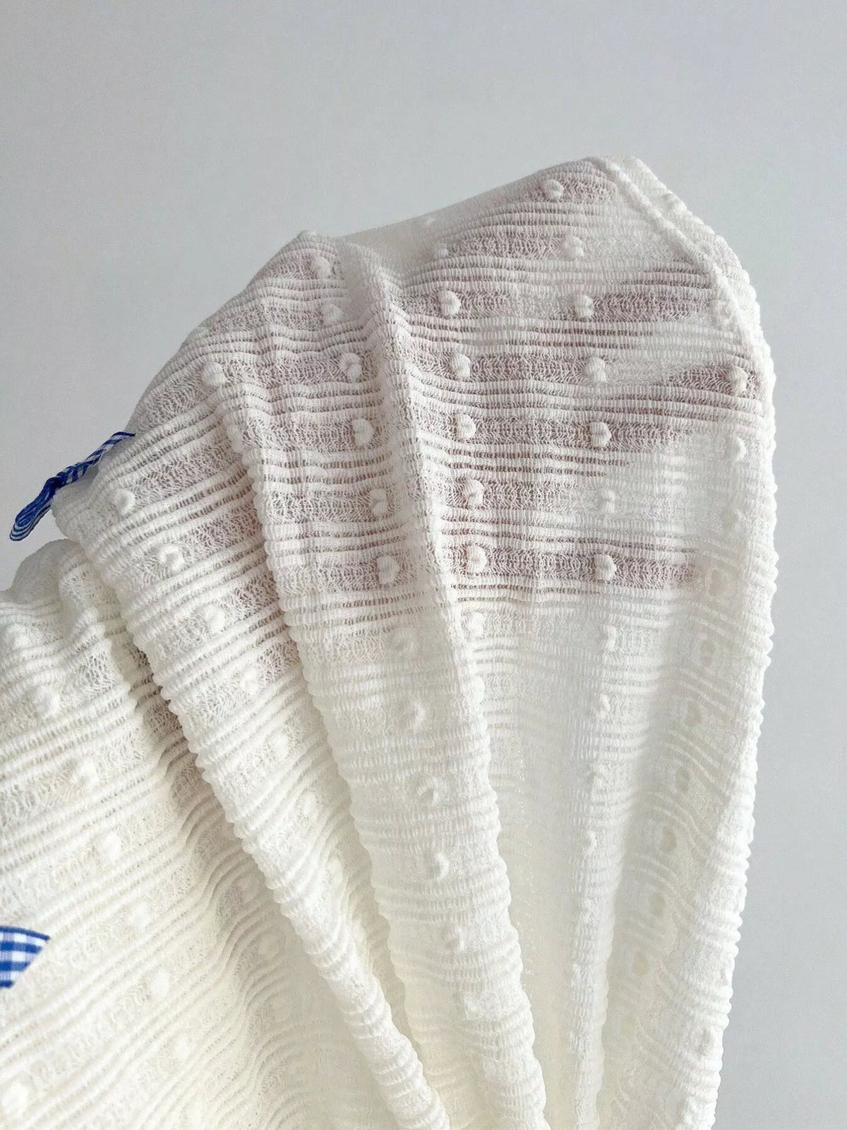 Side drawstring and ruched waist detail on the top
