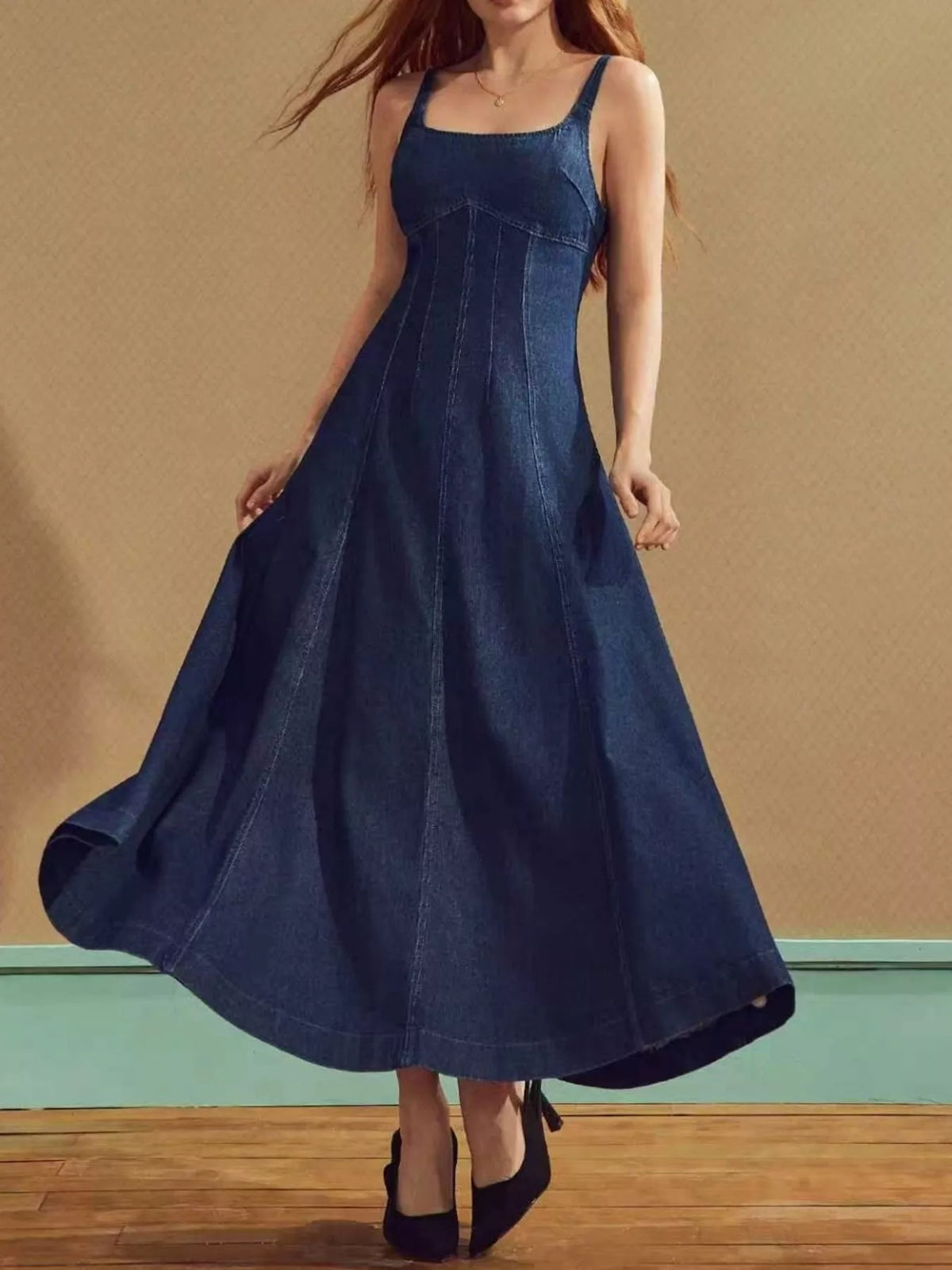 Blue denim dress shown from the side