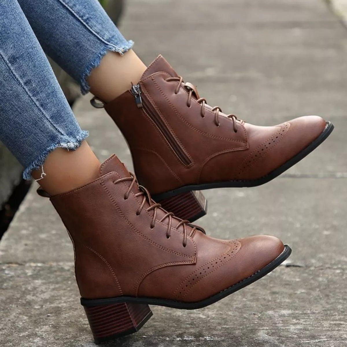 Lace up ankle boots with zipper pair standing together