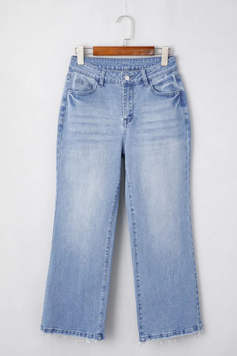 Angled pose in flare jeans