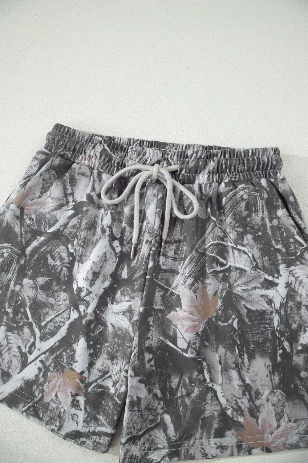 Grey abstract maple leaf print drawstring shorts styled outfit view