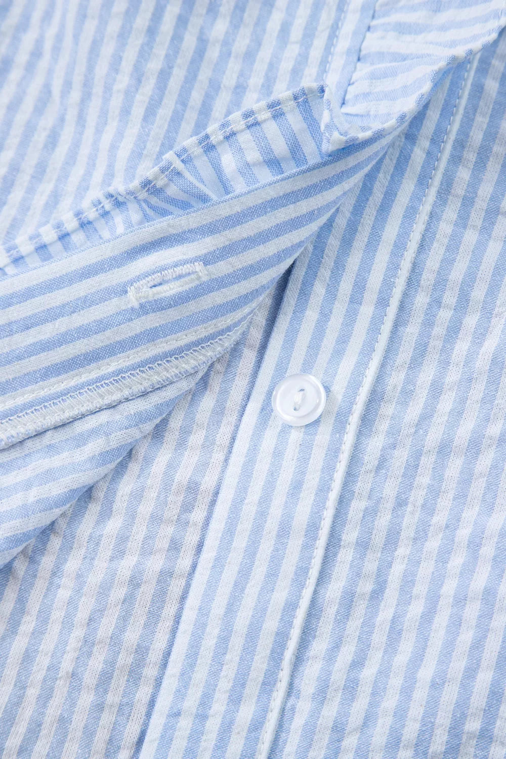 Light blue striped floral embroidered puff sleeve shirt full length view