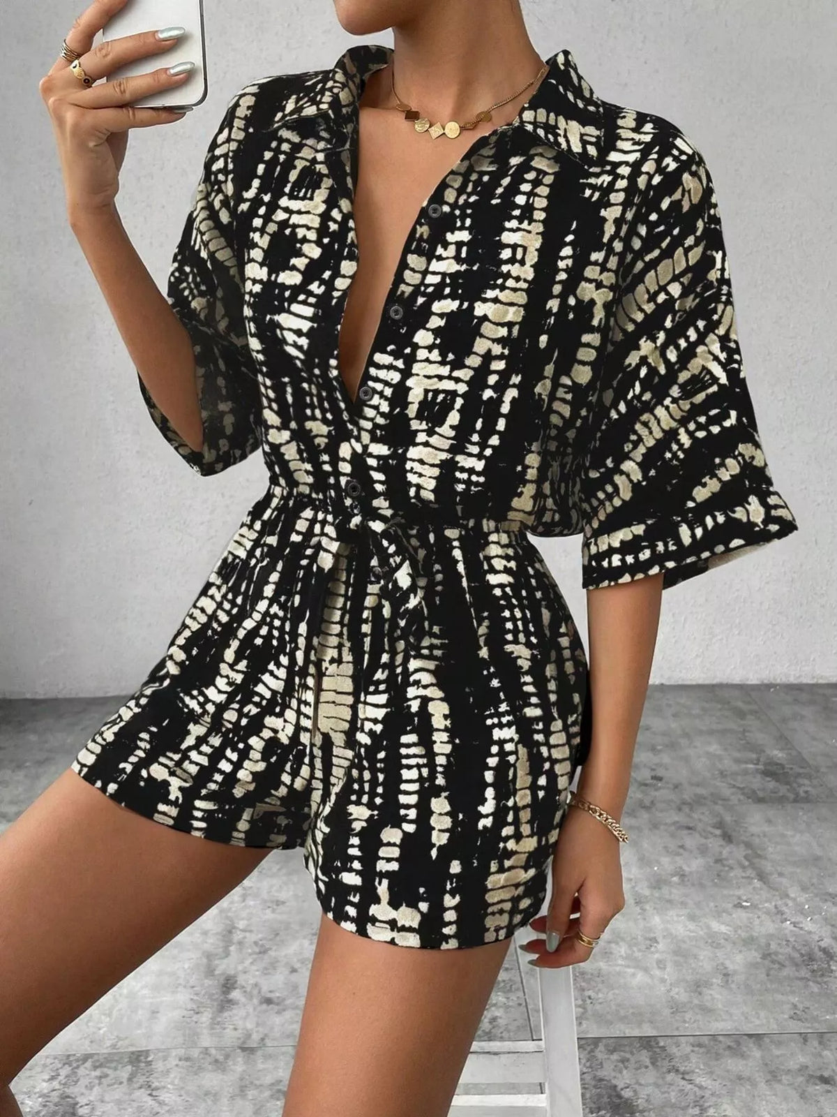 Striped belted romper close up of neckline