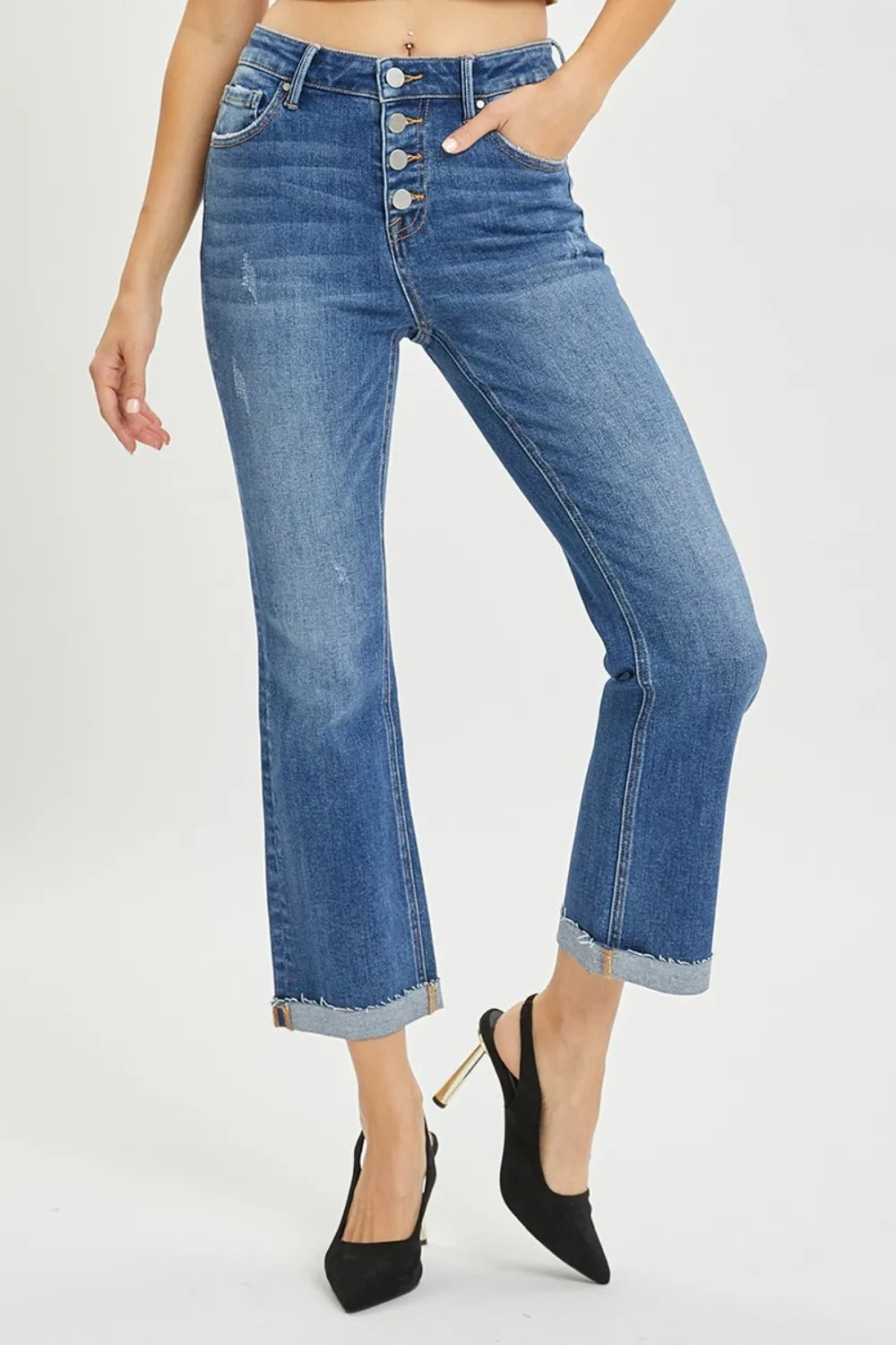 Model wearing dark wash bootcut jeans