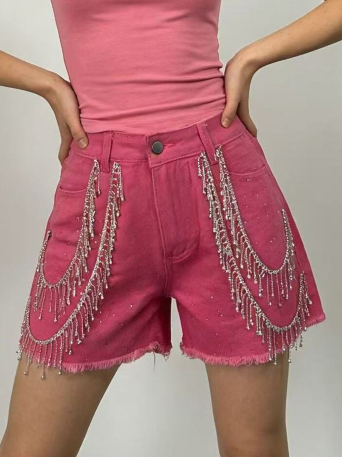 Embellished denim shorts styled with a fitted top