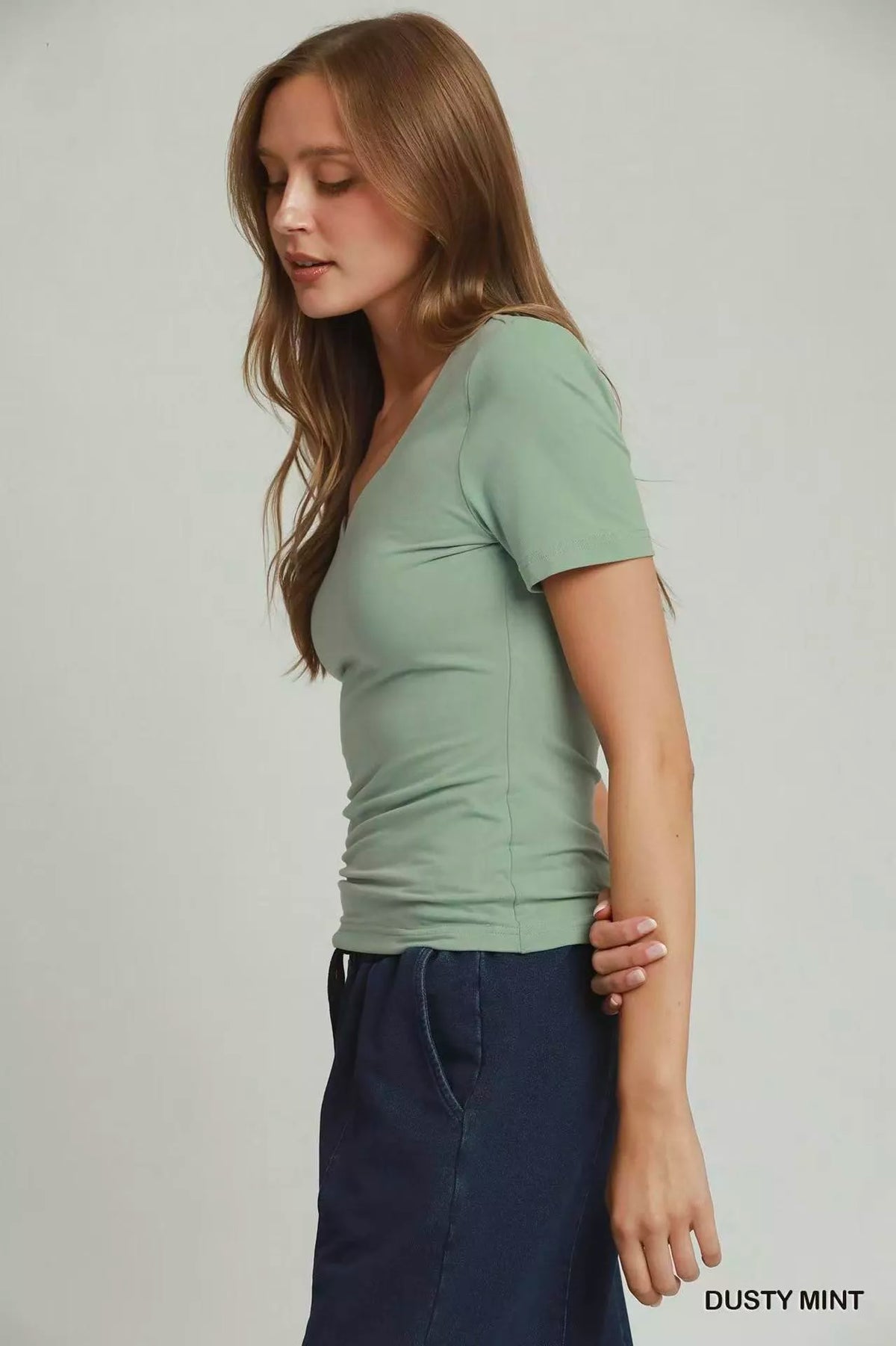 Dusty mint sweetheart neck top on model