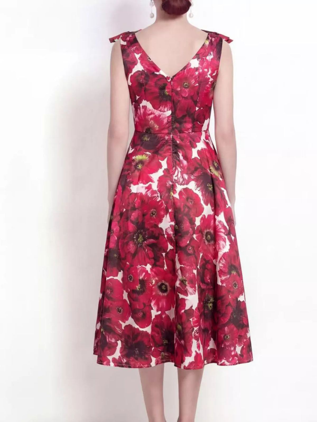 Close up of floral print and v neckline on burgundy dress