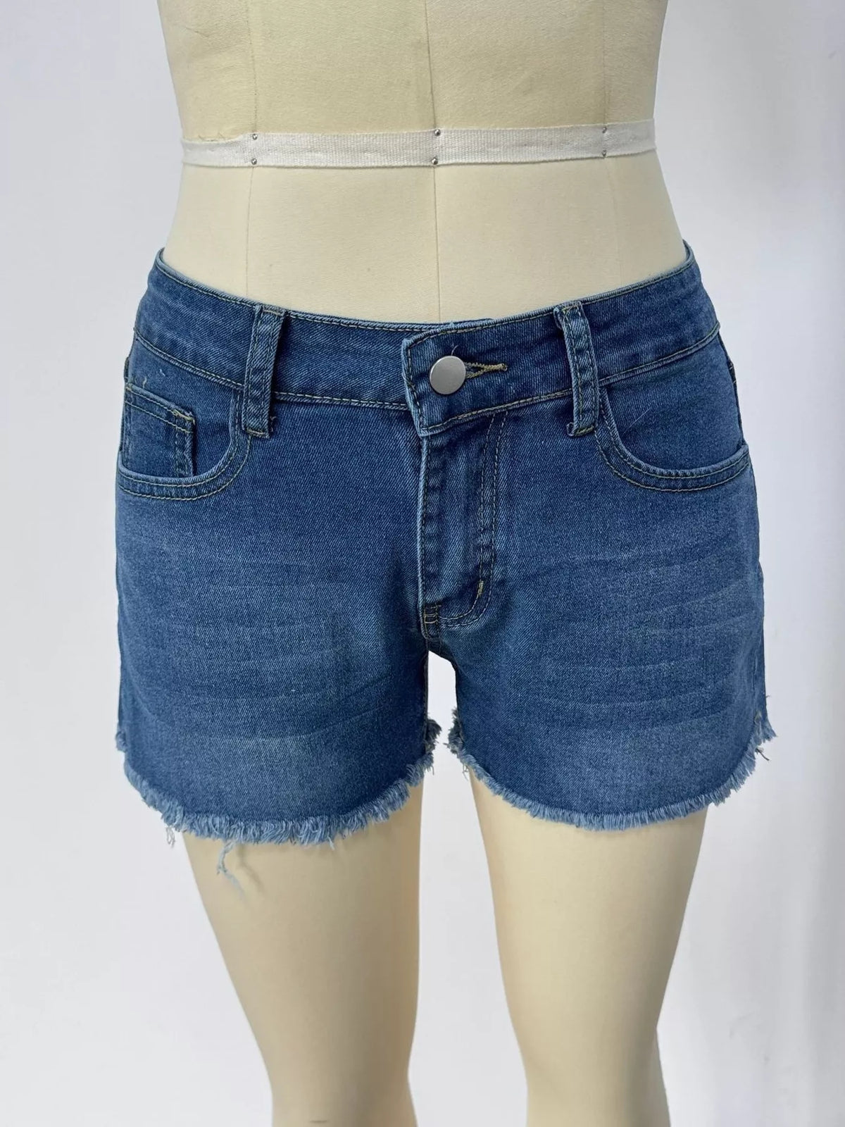 Raw hem denim shorts waistband detail