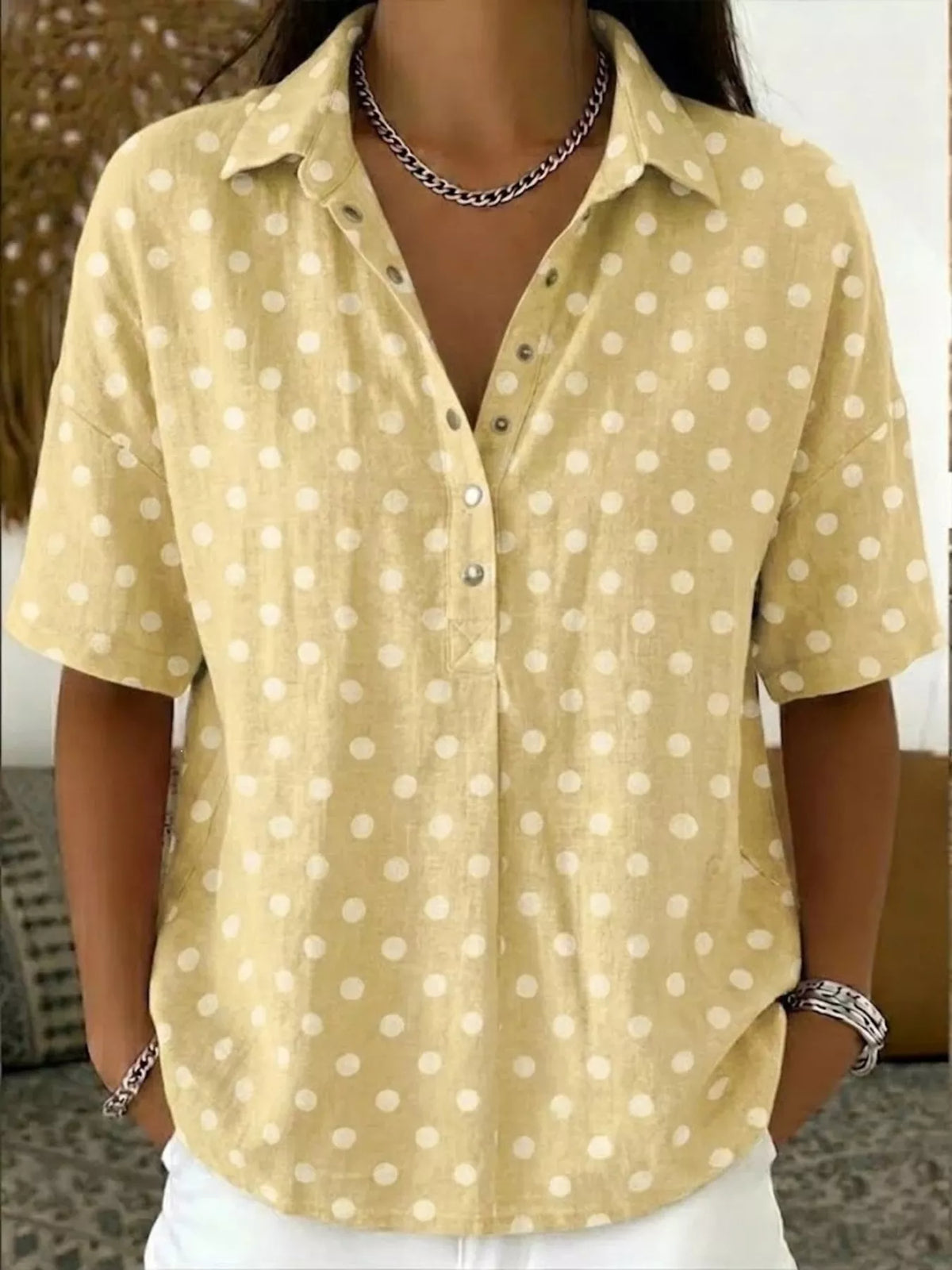 Polka dot shirt hem and length detail