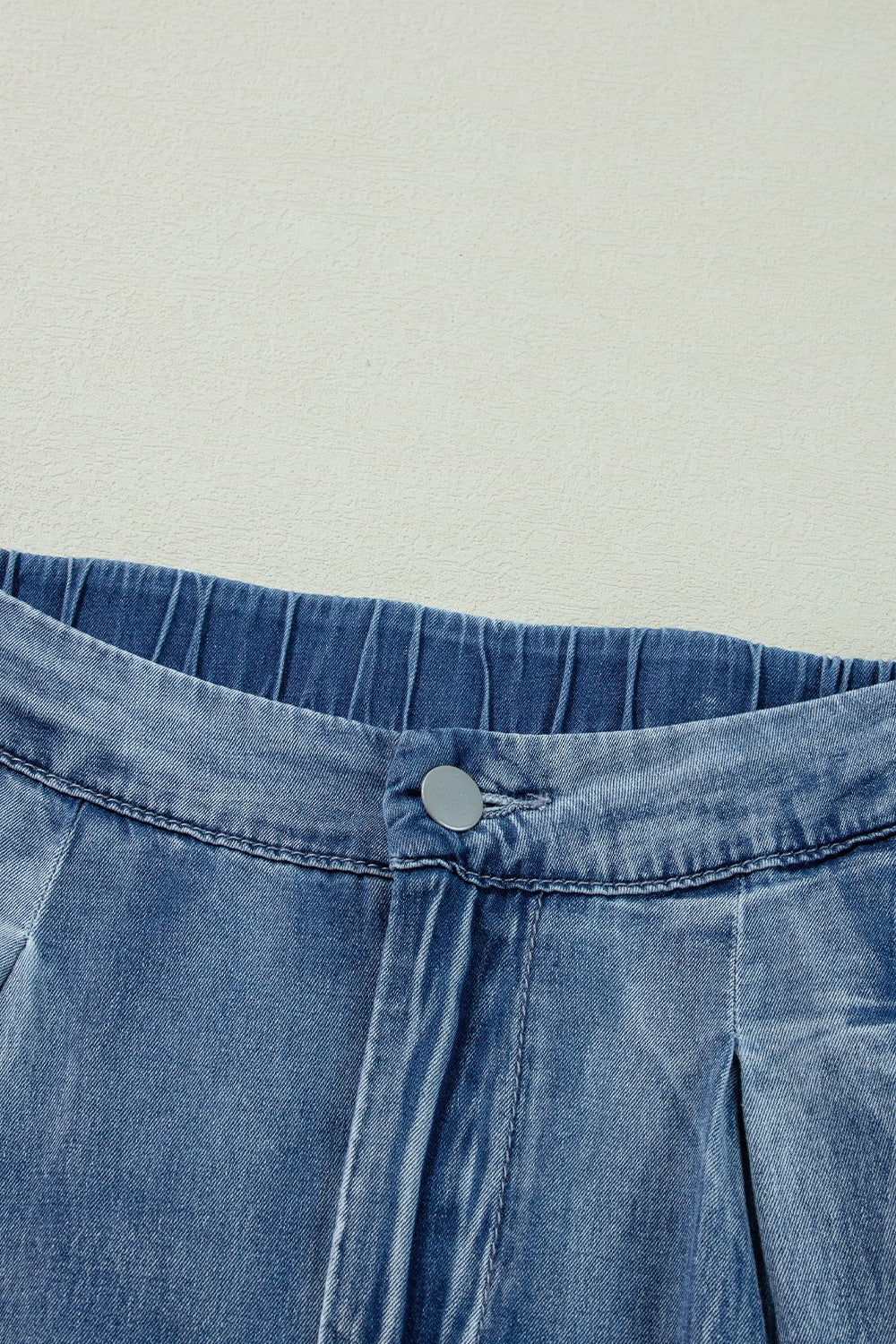 Full length styling of blue wide leg jeans