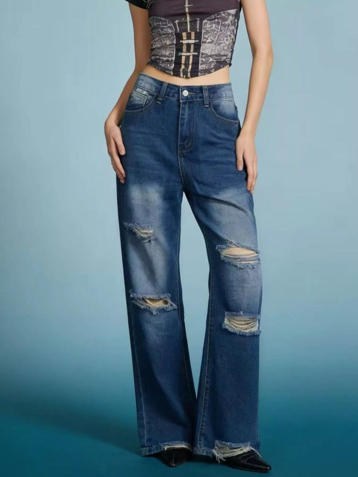 Ripped detail on blue wide leg jeans