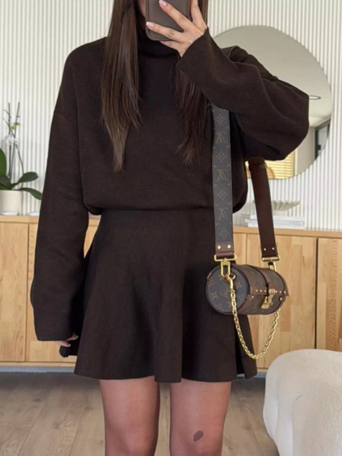 Round neck long sleeve sweater dress seated styled look