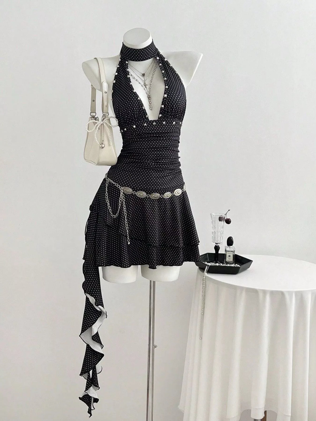 Black polka dot cutout front halter mini dress front view