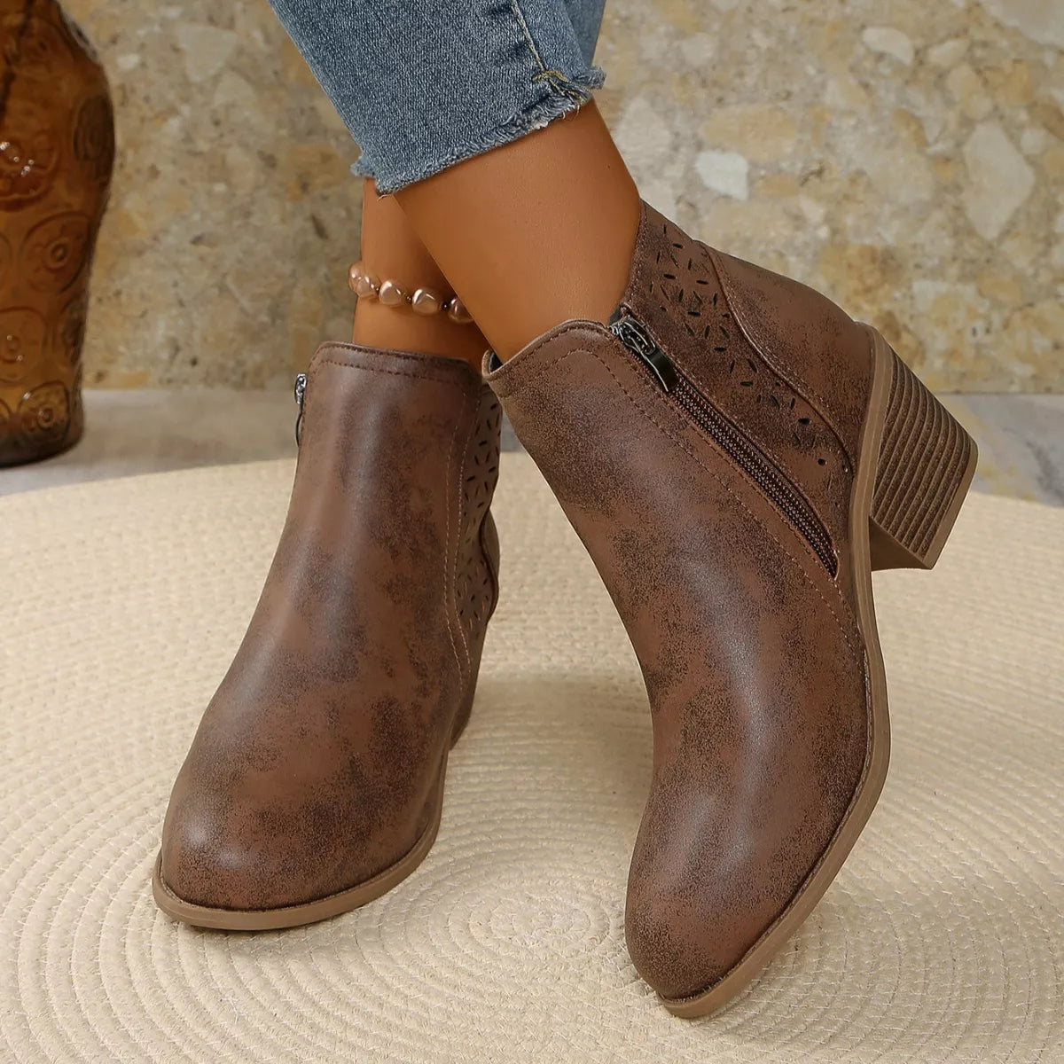 Point toe block heel boots worn on the foot
