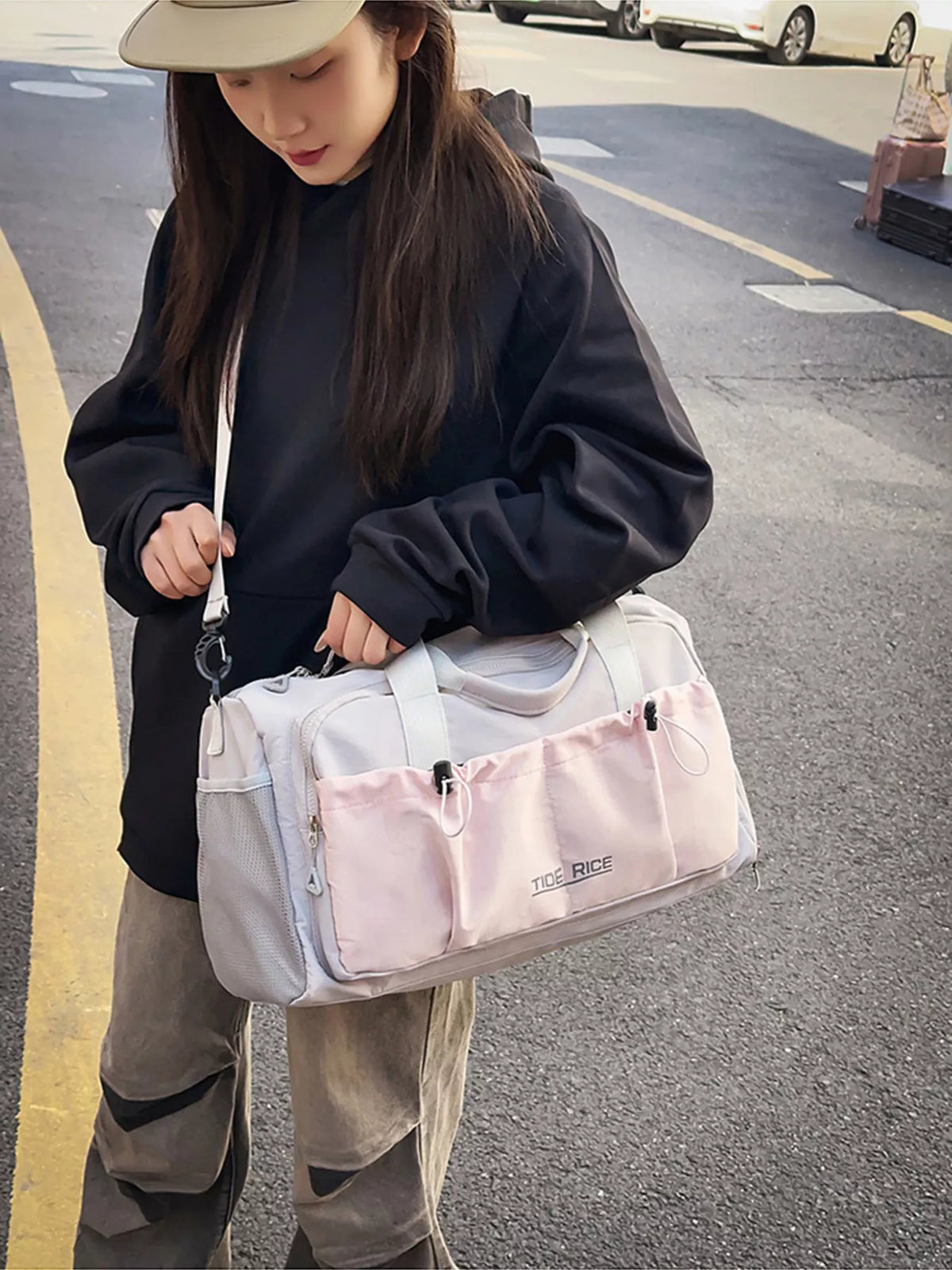 Pink duffel bag pocket detail