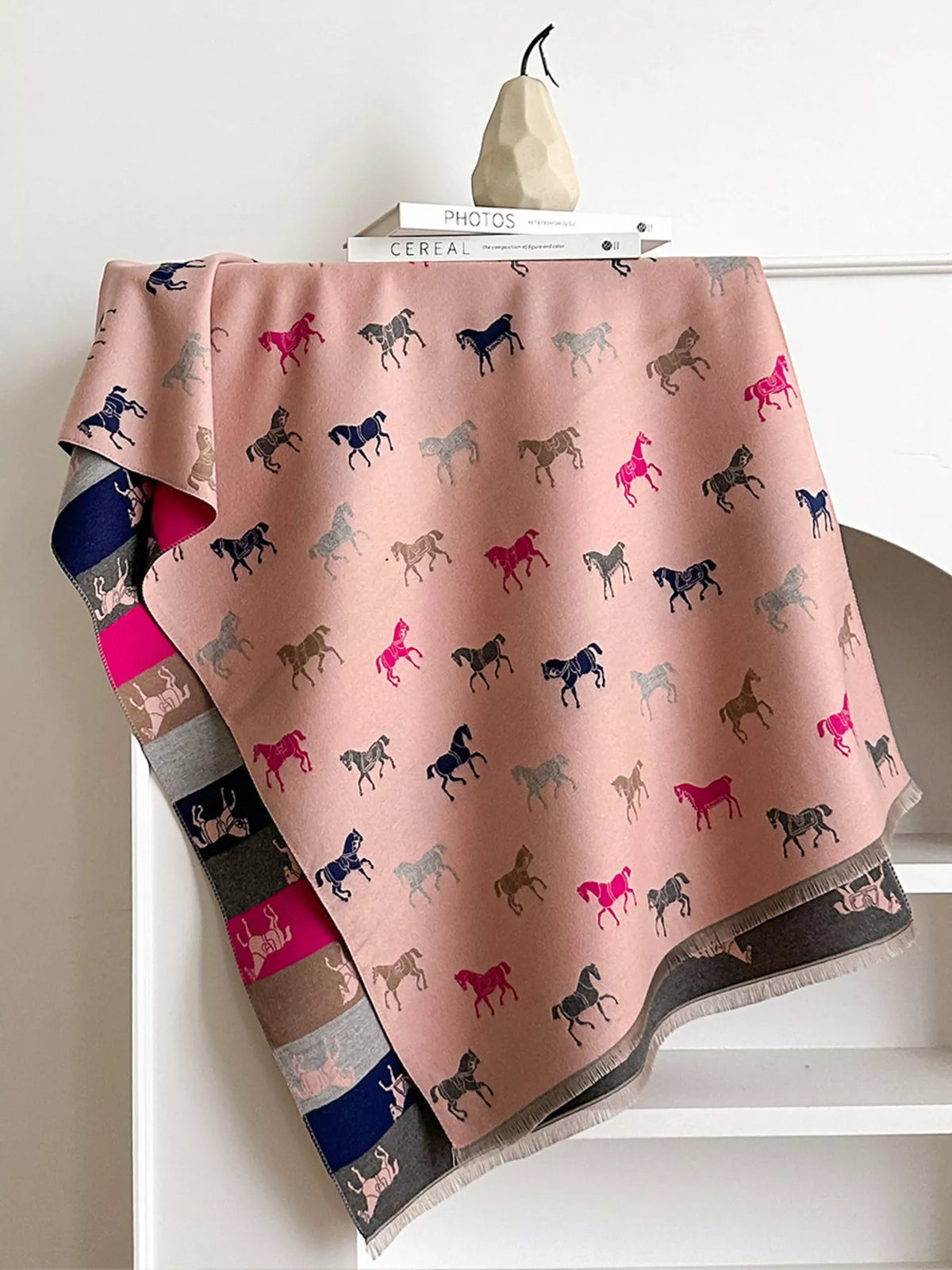 Horse print scarf draped over the shoulders
