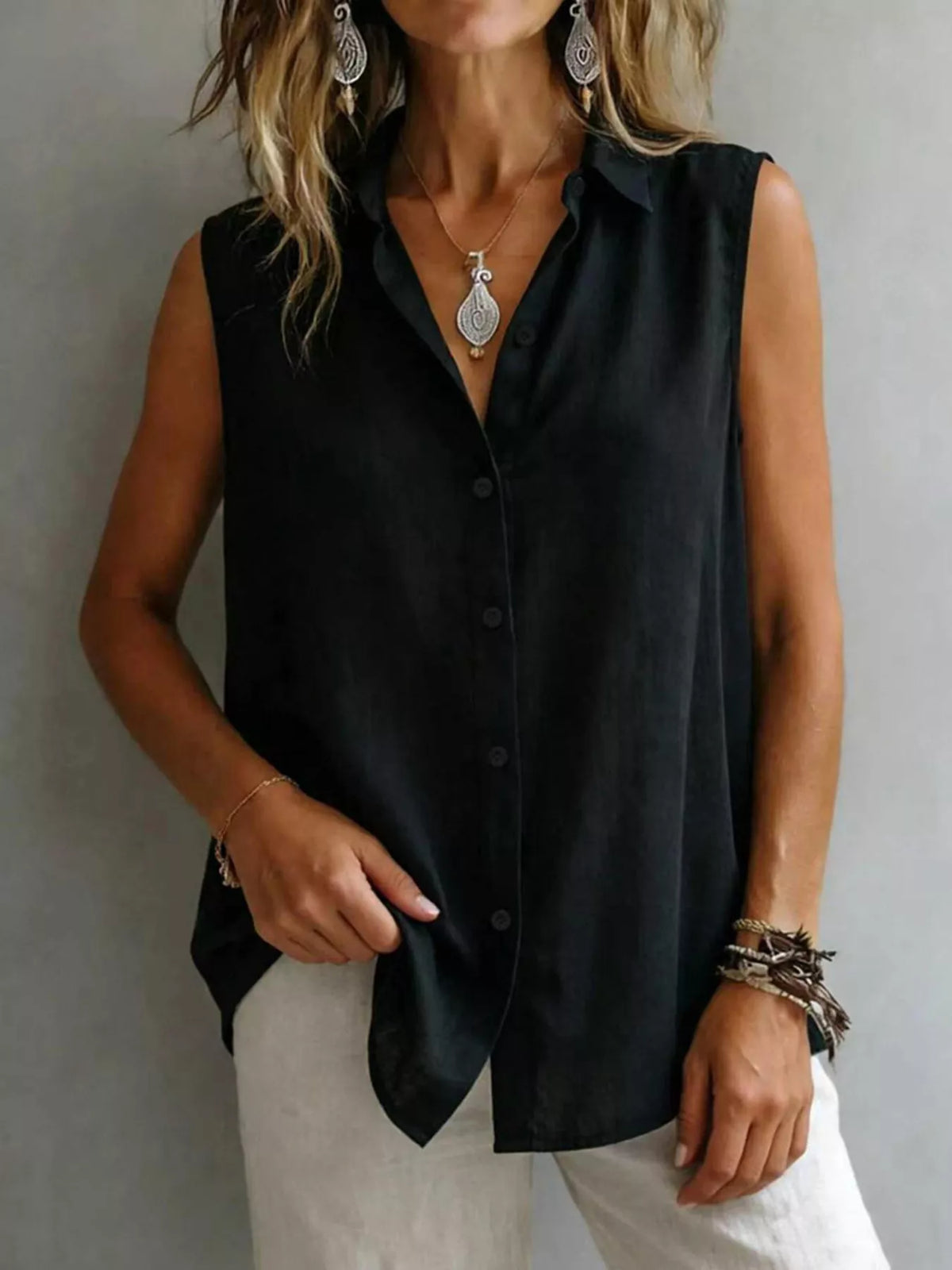 Sleeveless collared button down shirt fabric detail