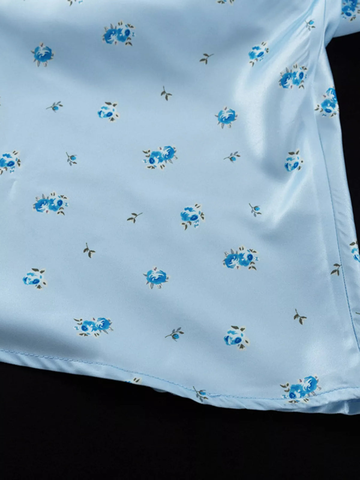 Fabric texture detail of the light blue maxi dress