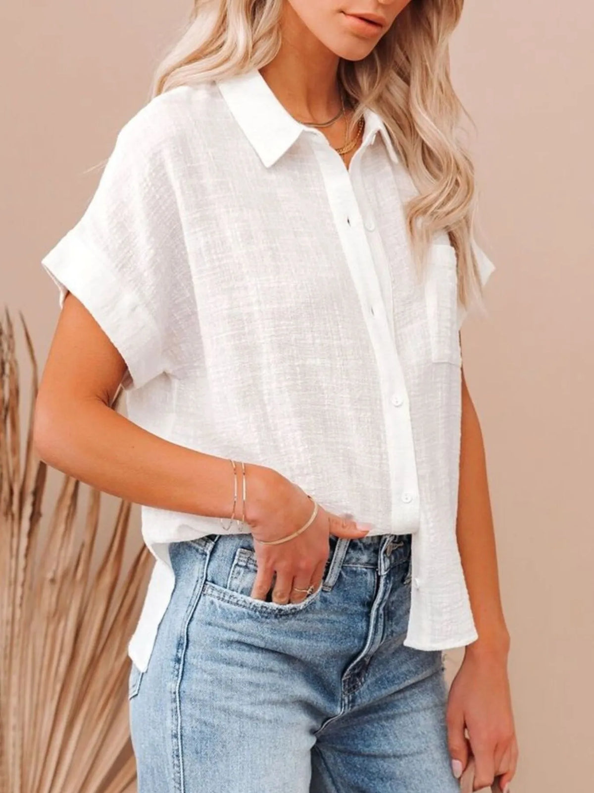 White short sleeve button up shirt back view