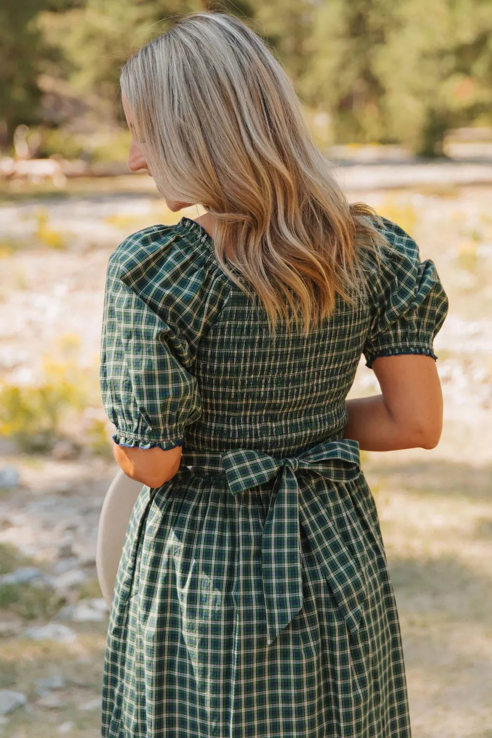 Back view of the smocked bodice on the plaid dress