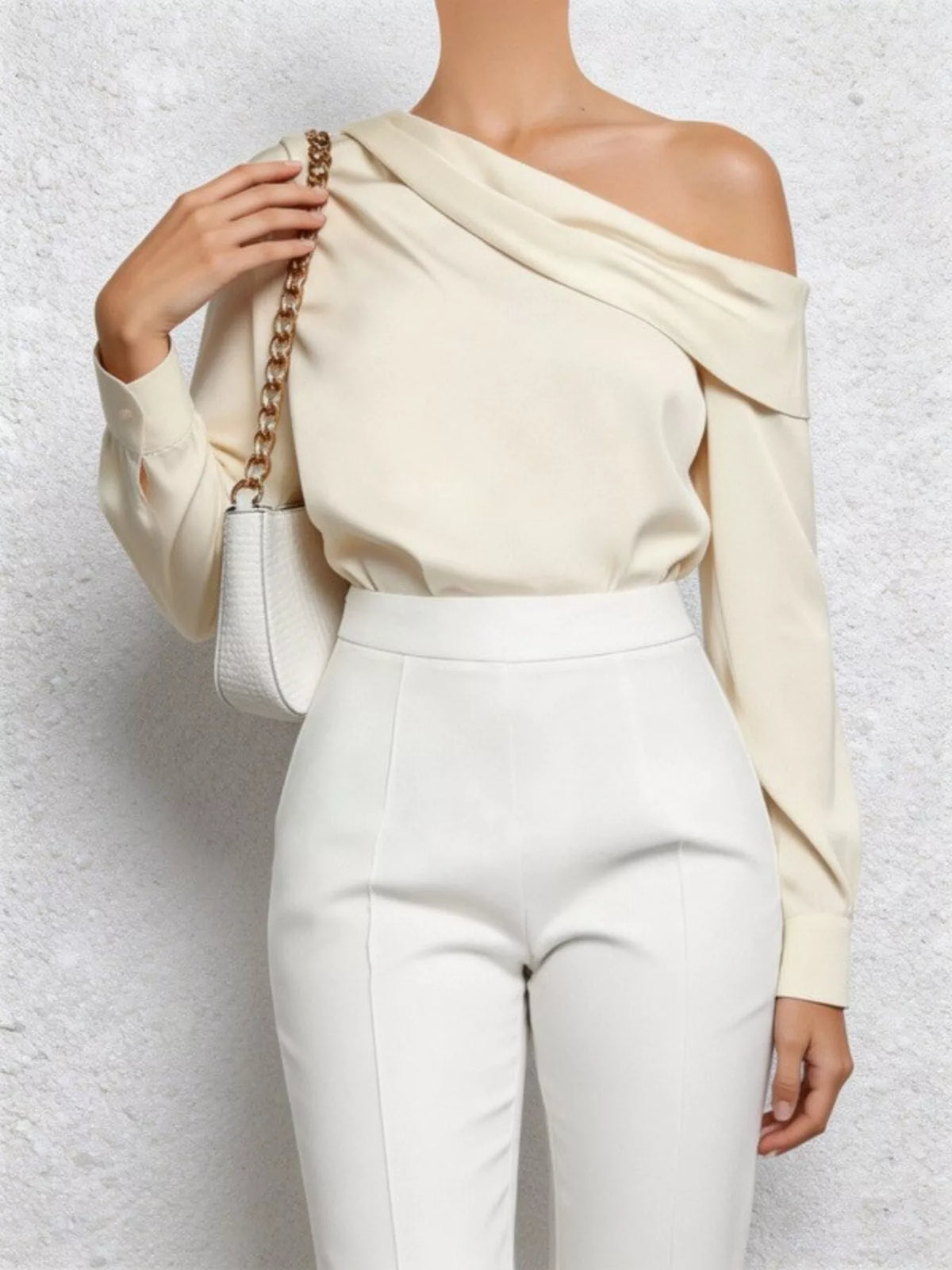 Cream one shoulder long sleeve blouse, styled on model