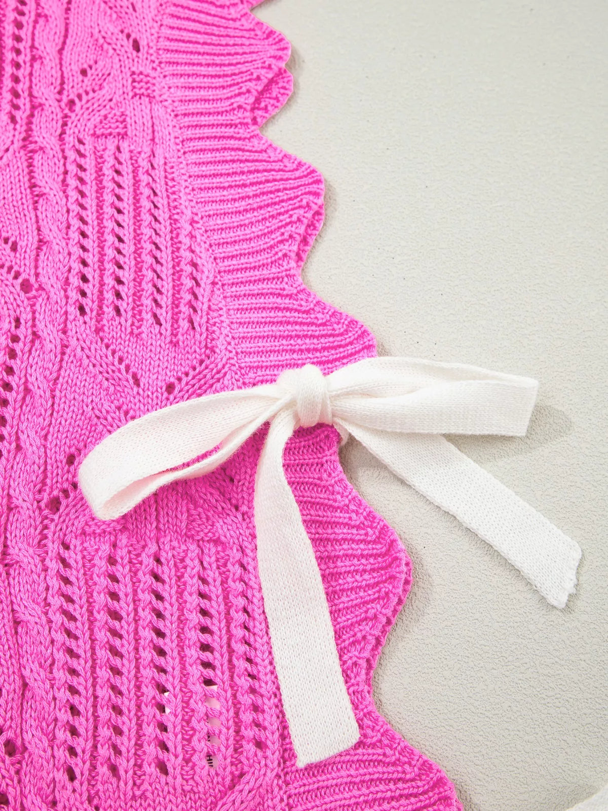 Pink openwork vest layered look
