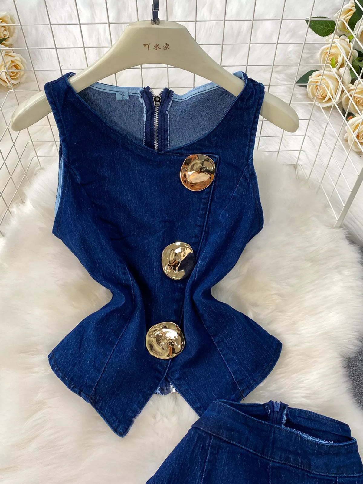 Button front denim vest detail