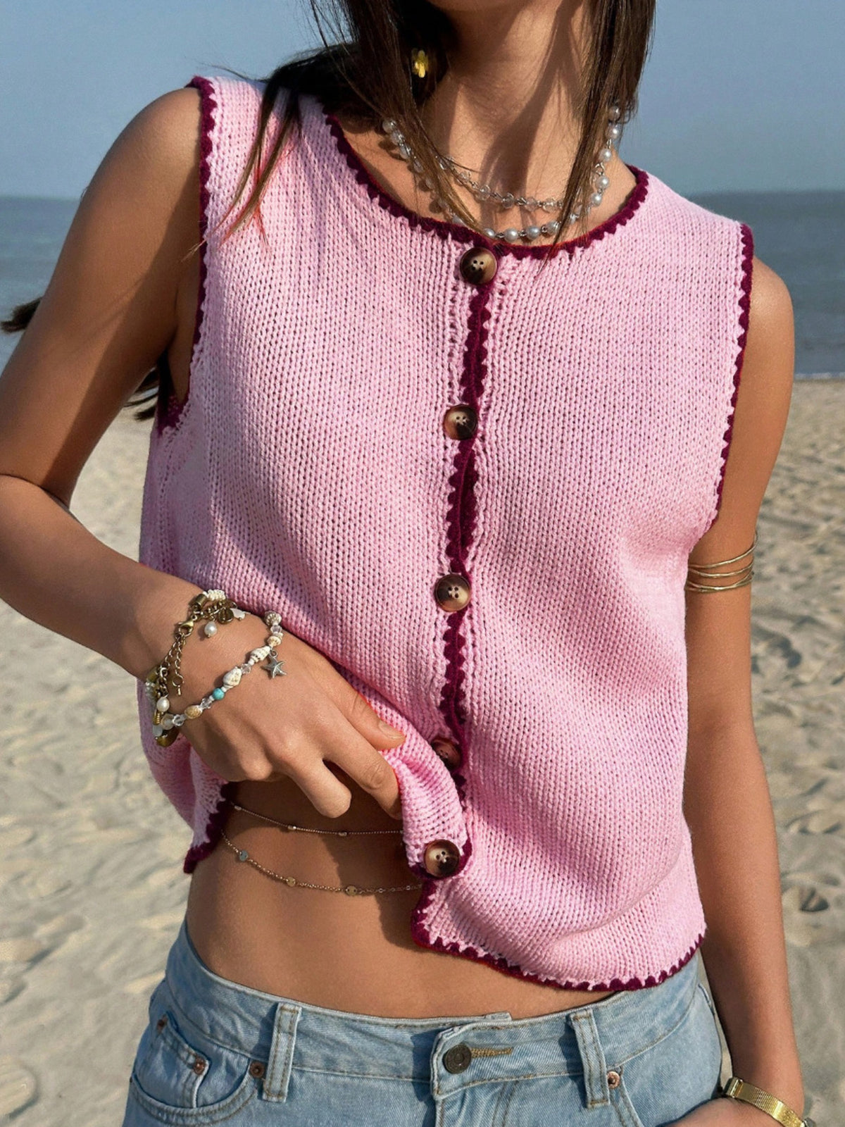 Sleeveless button down cropped vest detail