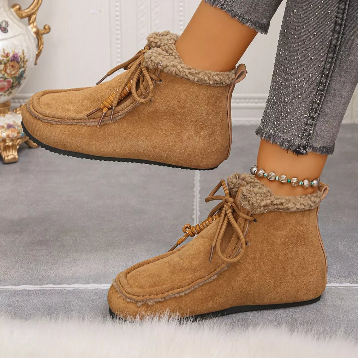 Lace up flat ankle boots styled on model