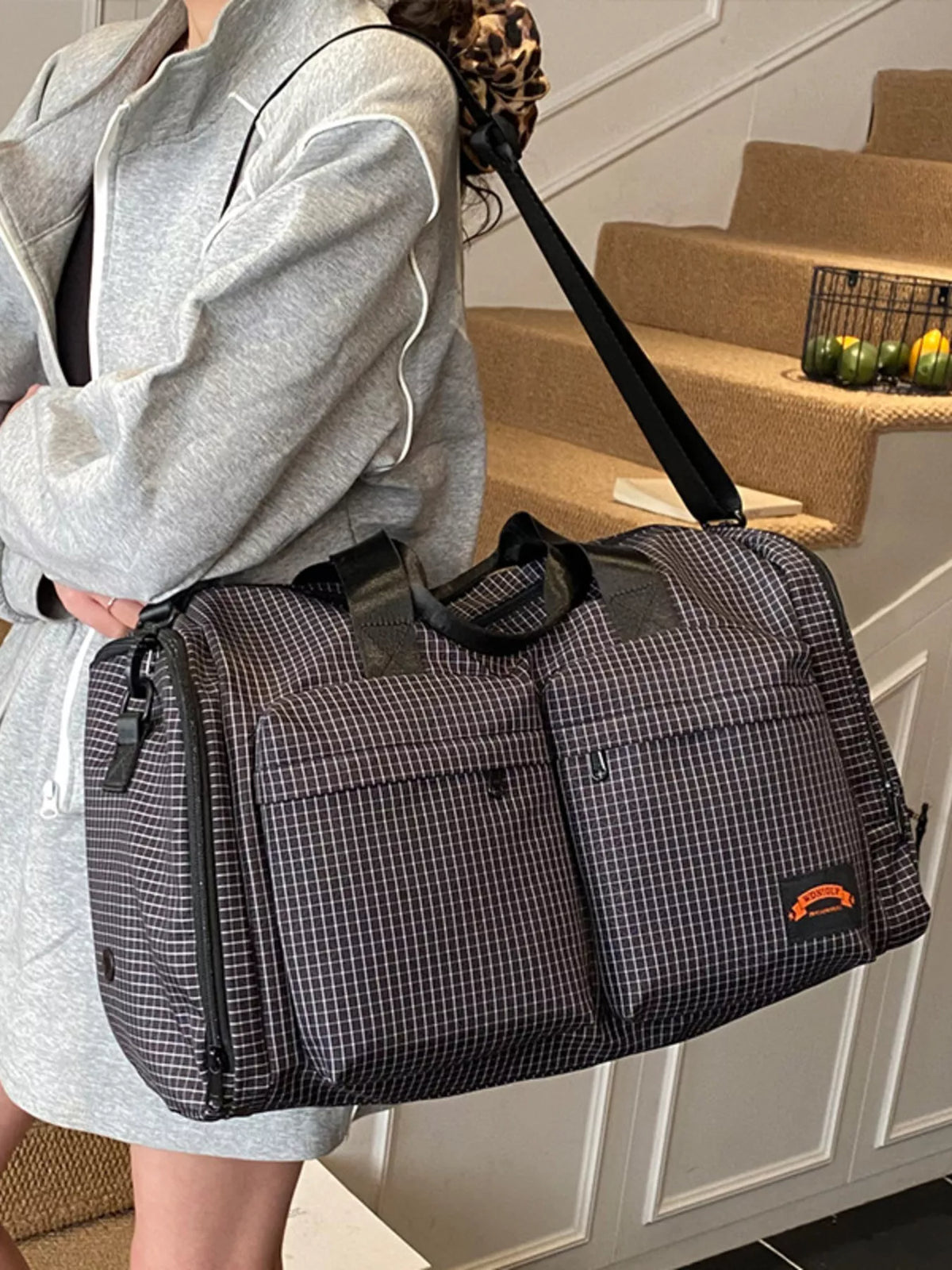 Black plaid duffel bag side view
