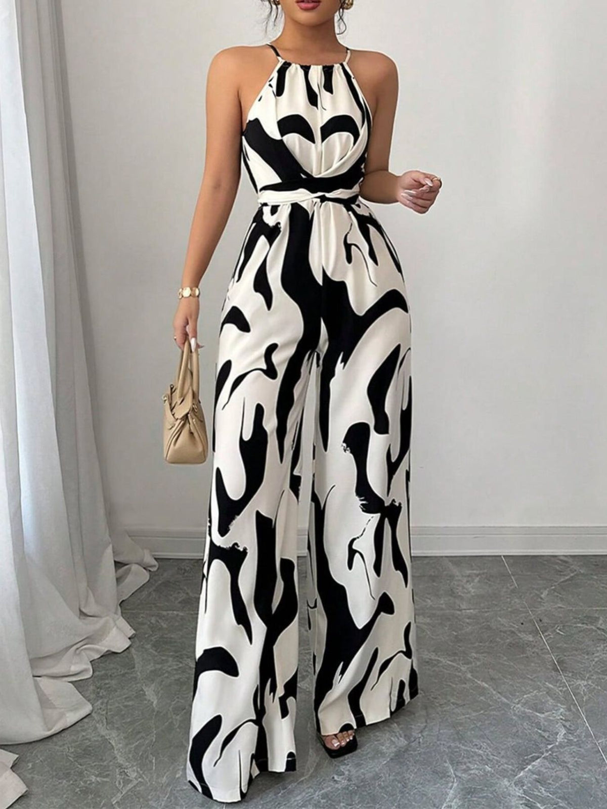 Side view of black printed wide leg jumpsuit