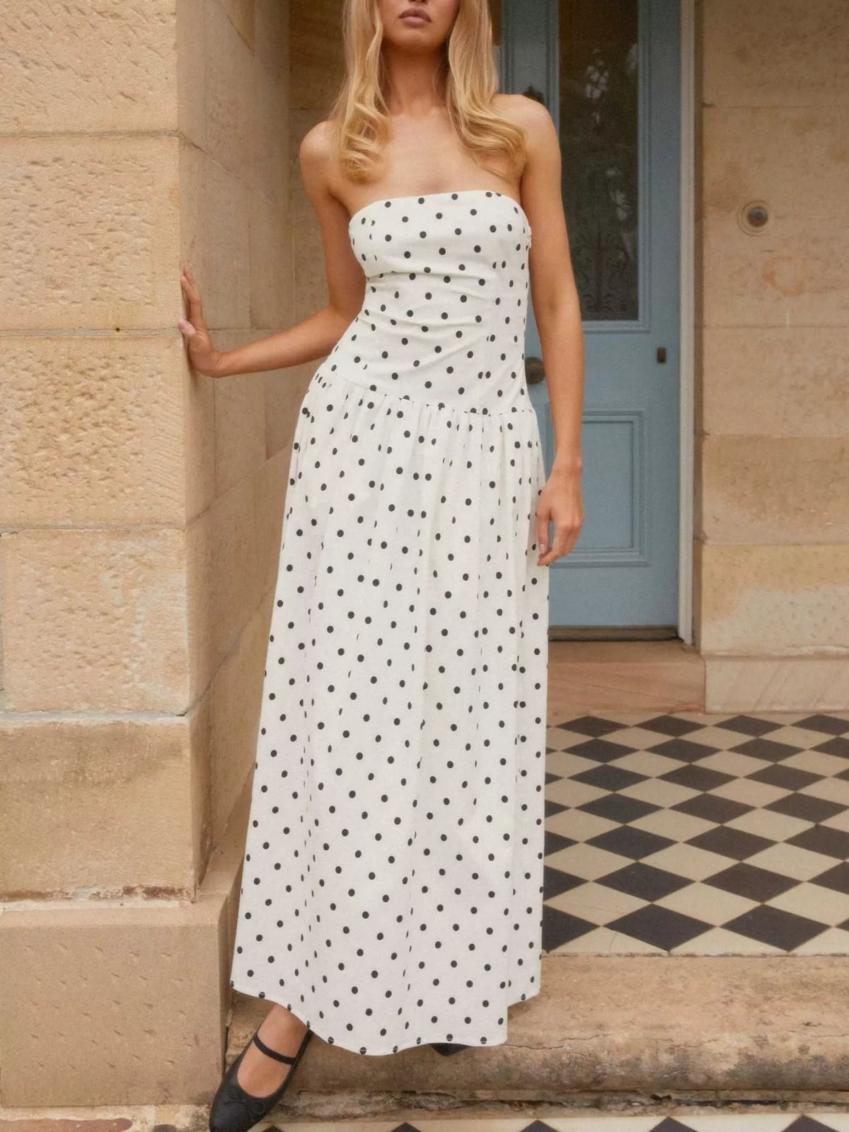Strapless printed maxi dress styled for evening