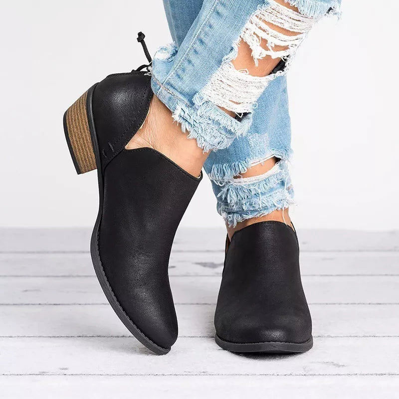 Point toe low heel boots angled three quarter view