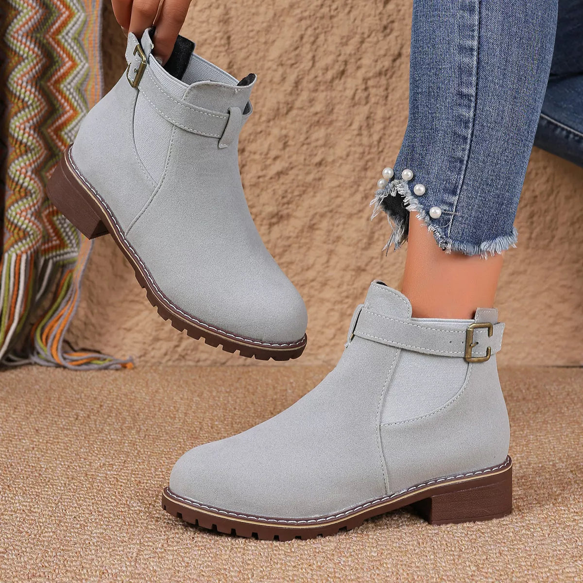 Round toe block heel boots paired with an outfit
