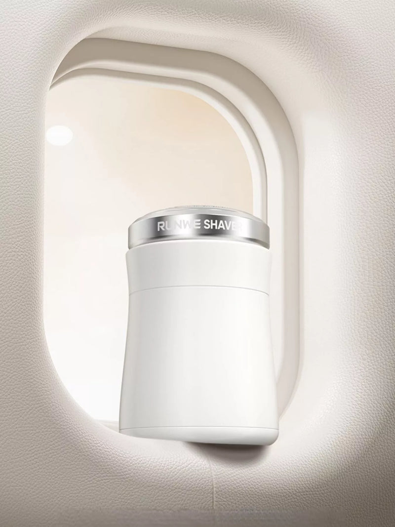White portable electric shaver front view